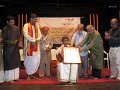 Mridangam artiste A. Radhesh receiving Ananya Yuva Puraskara